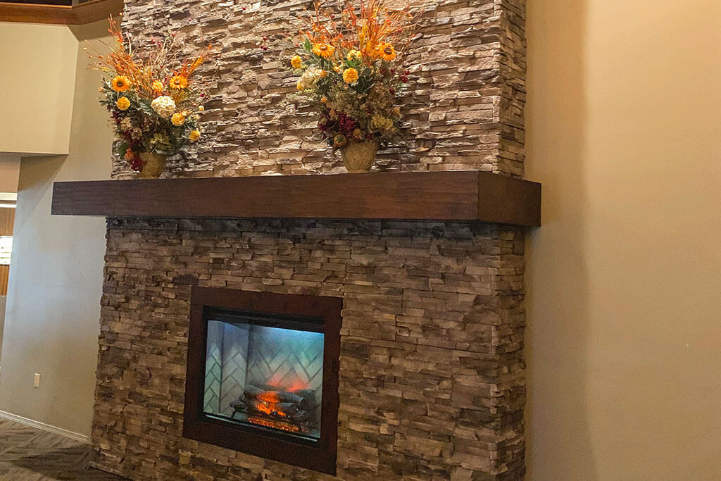 fireplace with stone accent wall
