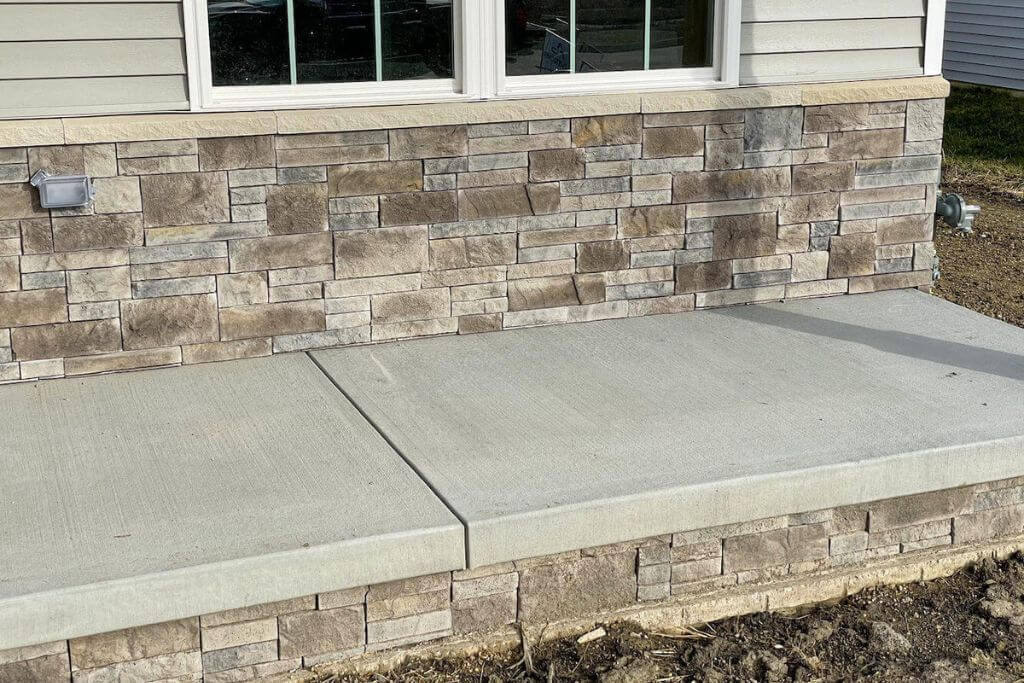 Covering house foundations with stone veneer